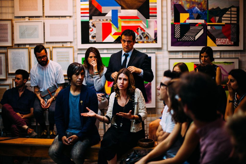 photo of an adult class with a student telling a story